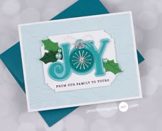 a christmas card with the word joy on it