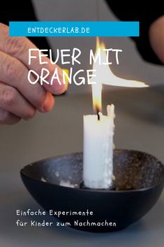 a person lighting a candle in a bowl with the words feuer mit orange on it