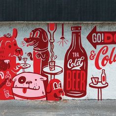 a wall painted with red and white graphics depicting various types of food, drinks and beverages