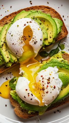 Discover your new favorite breakfast with this gourmet avocado toast with poached eggs! Creamy avocado on whole grain toast topped with perfectly poached eggs, a pinch of salt, pepper, and a sprinkle of red pepper flakes. This elegant yet easy recipe combines flavor and nutrition, making it perfect for any morning. Impress yourself and your loved ones with this delicious and healthy breakfast option! #AvocadoToast #GourmetBreakfast #PoachedEggs #HealthyEating #BreakfastIdeas #EasyRecipes #NutritiousMeals #MorningDelight #BrunchRecipes Poached Egg Breakfast Ideas, Bruschetta Ideas, Avocado Toast With Poached Egg, Poached Eggs Breakfast, Whole Grain Toast, Impress Yourself, Gourmet Breakfast, Avocado Breakfast, Toast Toppings