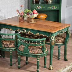 a dining room table and chairs with green painted furniture in front of a white brick wall