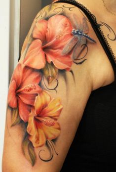 a woman's arm with flowers on it