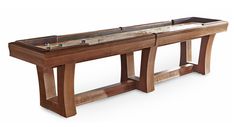 a long wooden table with two benches on one side and a shuffle board on the other