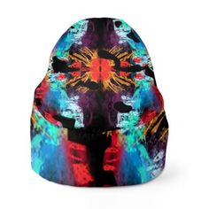 a colorful beanie hat with an abstract design