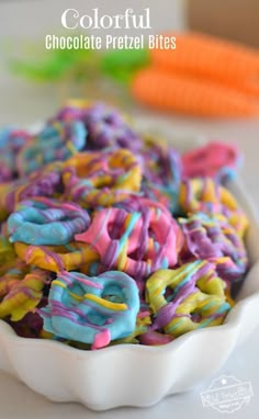 colorful chocolate pretzel bites in a white bowl