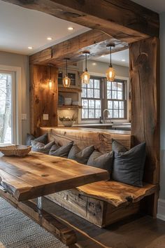 a living room filled with furniture and a wooden table in front of a large window