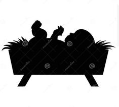 a black and white silhouette of a baby in a manger