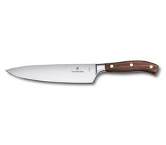 a large knife with a wooden handle on a white background