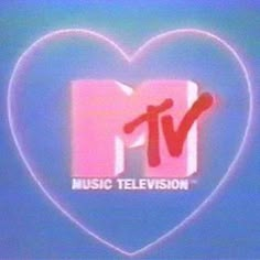 the logo for music television is displayed in front of a blue background with a pink heart