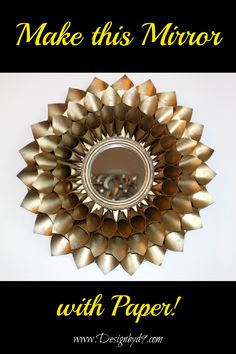 a mirror that has been made into a flower with paper flowers on it and the words make this mirror with paper