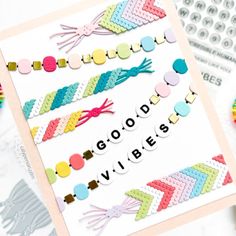 a card with the words good vibes written on it and colorful crochet beads