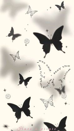 black and white butterflies flying in the sky with words written on them that read happy new year