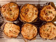 six muffins sitting on top of a cooling rack