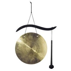 a gong hanging from a hook on a white background