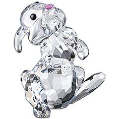 a crystal dog figurine sitting on its hind legs