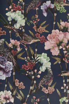 a blue wallpaper with flowers and birds on the top one is pink, green, purple and white