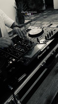 a man is playing music on his dj equipment