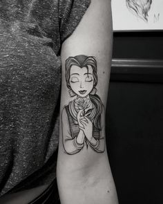 a woman with a tattoo on her arm