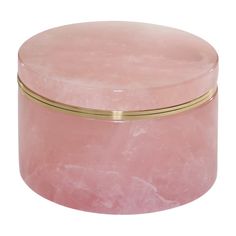 a pink marble box with gold trim around the lid