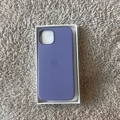 an iphone case sitting on top of a carpet