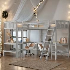 there is a loft bed with desk and ladders in the room next to it