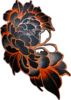 an orange and black flower on a white background