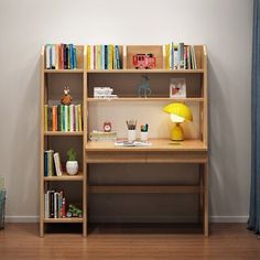 a wooden desk with books and toys on it