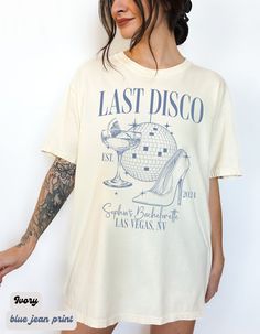 a woman wearing a t - shirt with the words last disco printed on it