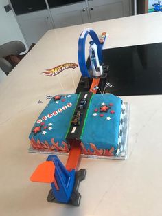 a cake shaped like a race track on top of a table