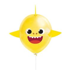 a yellow balloon with a smiling face on it