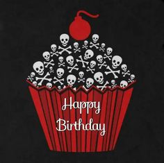 a cupcake with skulls on it and the words happy birthday