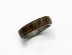 TAGS : Raw stone Ring, Marriage ring, Husband gift, Sister gift, Man Jewlery, Titanium man ring, Anniversary gift, Stone inlayed ring, Promise wood ring, dinosaur fossil ring, petrified bone gift, fossil dino ring, Teak wood ring RING SPECIFICATION: METAL: High-grade Titanium (5 and 6 grade) FITTING: Standard INLAY: Dinosaur fossil bone , petrified WOOD: Teak SIZE: 5 to 16 US WIDTH : 4 to 12 mm The ring pictured measures 6 mm in width We do all sizes for men and women US/Canada scale from 3 to 1 Dino Ring, Ring Marriage, Wedding Band Men, Fossil Ring, Damascus Ring, Titanium Rings For Men, Dinosaur Fossil, Fossil Bones, Marriage Ring