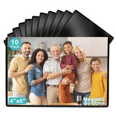 four black plastic placemats with an image of family in the background