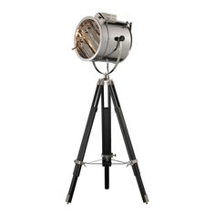 an old fashioned tripod light on a white background