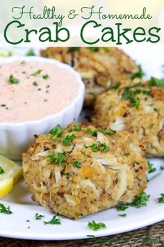 crab cakes on a plate with dipping sauce