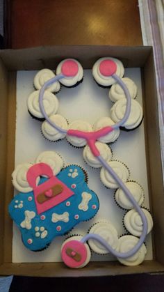 a cupcake in a box with a stethoscope on it and a heart