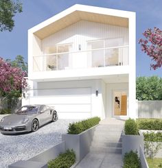 a car is parked in front of a house with stairs leading up to the second floor