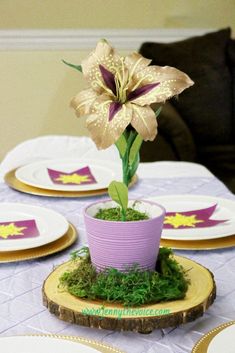 a table topped with plates and a flower pot