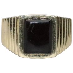 14 KT yellow gold ring that introduces a stunning black onyx stone center which is measured at 10 mm in length by 7 mm in width and presents a unique line design on the sides. The ring has a total weight of 7.8 grams and is a size 10. This ring is hallmarked 14 KT yellow gold and been checked for authenticity by a professional. Modern Onyx Rings For Formal Occasions, Modernist Black Signet Ring With Polished Finish, Classic Black Rings With Polished Edges, Classic Black Signet Ring With Polished Edges, Modern Black Signet Ring With Polished Edges, Black Rectangular Signet Ring For Formal Occasions, Modern Black Rings For Formal Occasions, Modern Black 14k Gold Rings, Modern Onyx Signet Ring For Anniversary