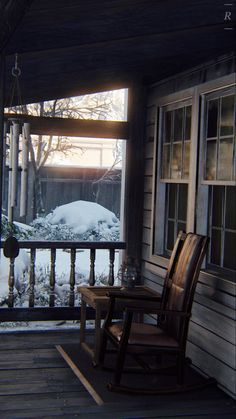 a rocking chair sitting on top of a wooden porch next to a snow covered ground