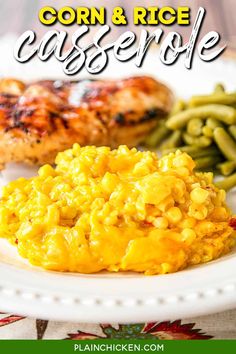 corn and rice casserole on a white plate with green beans next to chicken