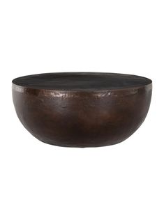 a large brown bowl sitting on top of a table