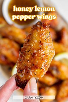 honey lemon pepper wings on a plate with dipping sauce