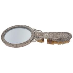 an ornate looking mirror with a toothbrush in it