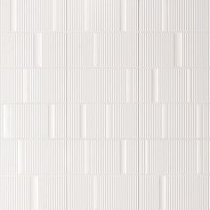 a white wall with vertical lines on it