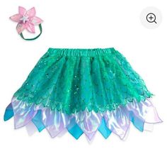 This Listing is for Disney Store The Little Mermaid Ariel Tutu Set for Tweens Size: 13/14 Celebrate a dancing, musical life under the sea with this colorful tutu and matching headband inspired by the Little Mermaid herself, Ariel. Sequins and ornament accents will make this outfit a treasured part of your world. ▪Set includes tutu skirt and stretch headband ▪Multi-layered organza tutu features undersea color and green sequins pattern ▪Headband features pink flower with plastic ''pearl'' studs an Ariel Halloween Costume, Mermaid Tutu, Little Mermaid Costume, Ariel Little Mermaid, Life Under The Sea, Tutu Costumes, Disney Ariel, Stretch Headband, Mermaid Costume