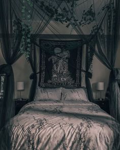 a bed with an intricately decorated headboard and canopy in a dark colored room