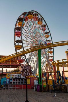 an amusement park with a ferris wheel and other rides