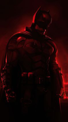 the dark knight is standing in front of red light