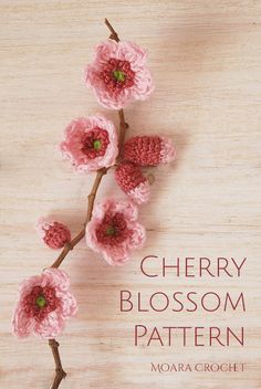 crochet cherry blossom pattern on wooden background with text overlay that reads cherry blossom pattern